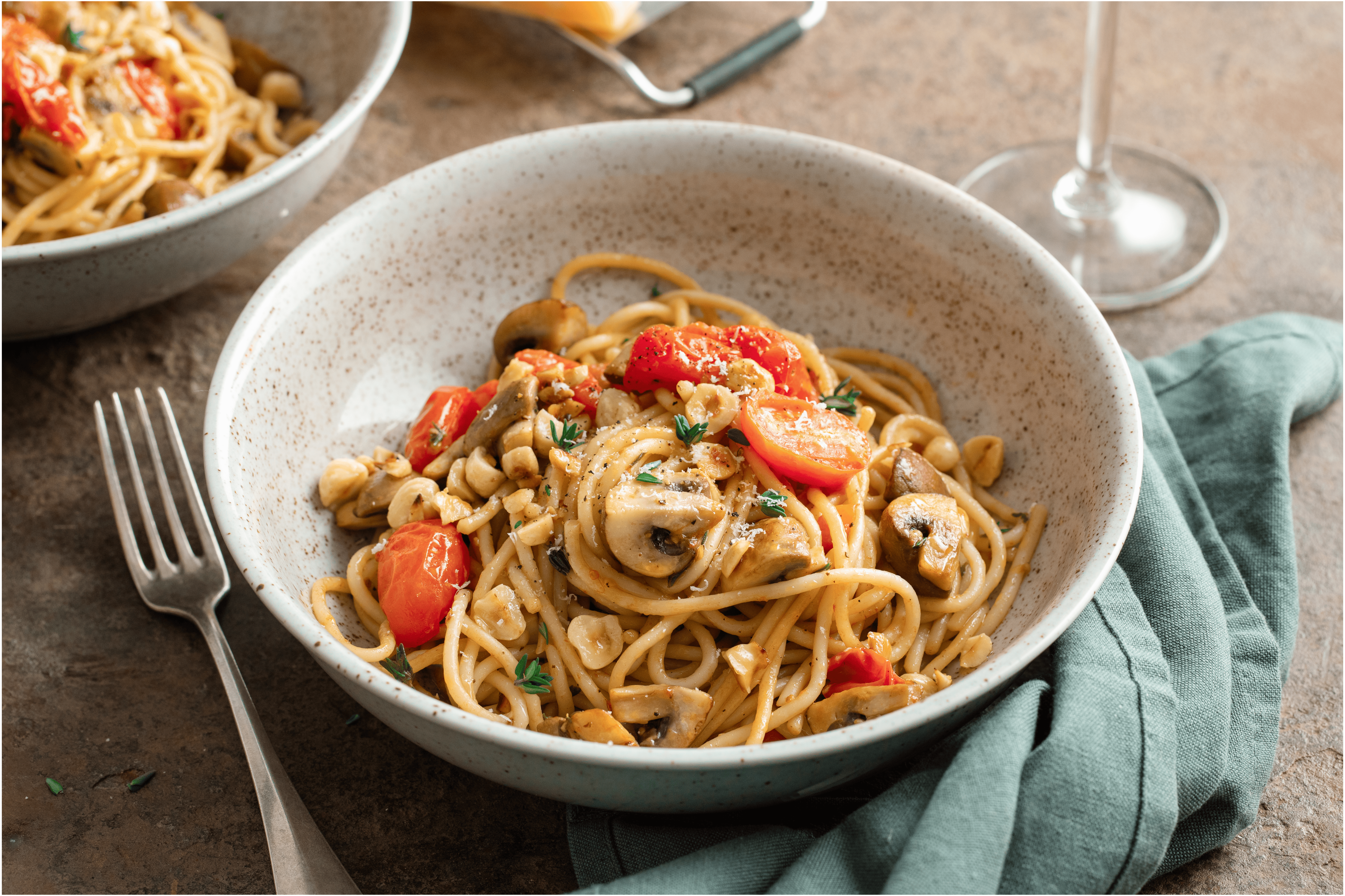 Spaghetti met champignons en hazelnoten