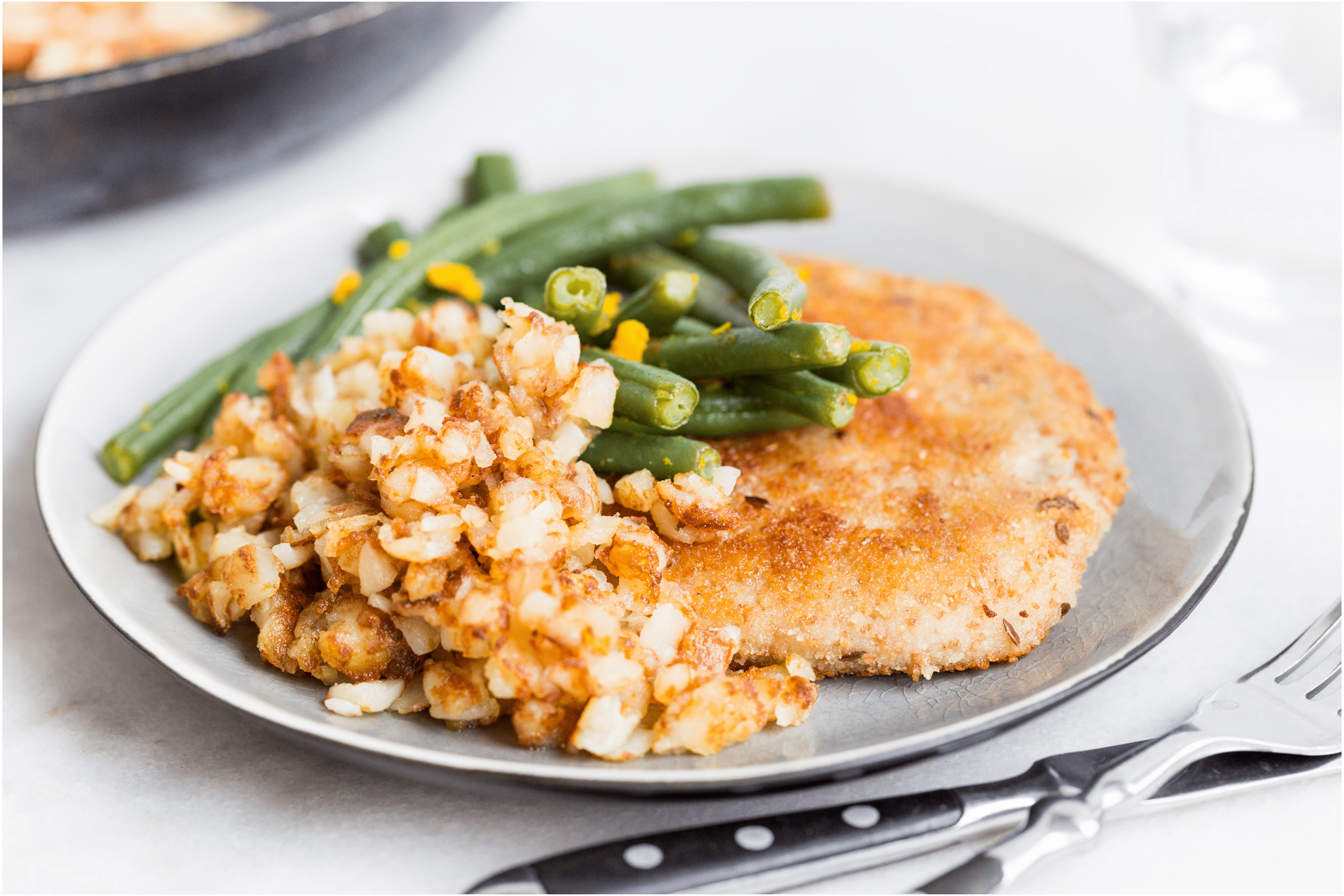 Wienerschnitzels met rösti en sinaasappelboontjes