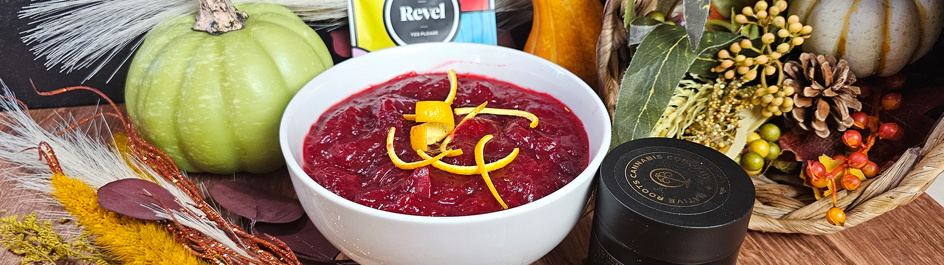 Infused Orange Cranberry Sauce pictured with fall decor and Native Roots Gold Label and Revel products