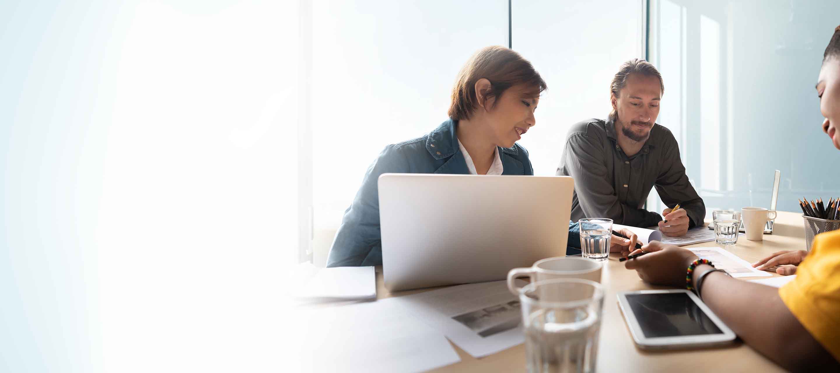 A diverse group of coworkers discusses a project