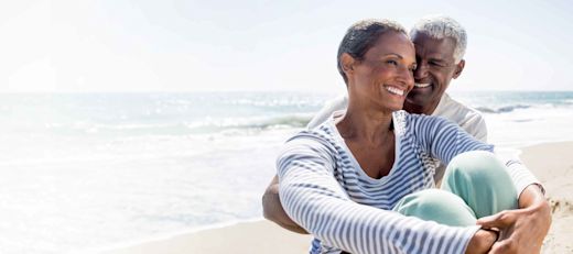 Retired couple enjoying the beach