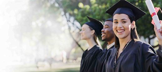 College or academy class graduate group in an outdoor campus portrait
