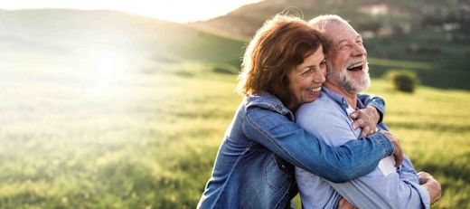 A couple takes a break in a field