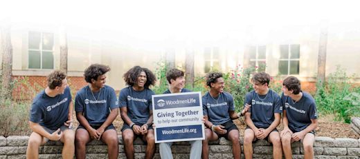 A group of high school boys volunteering at a Giving Together landscaping project.
