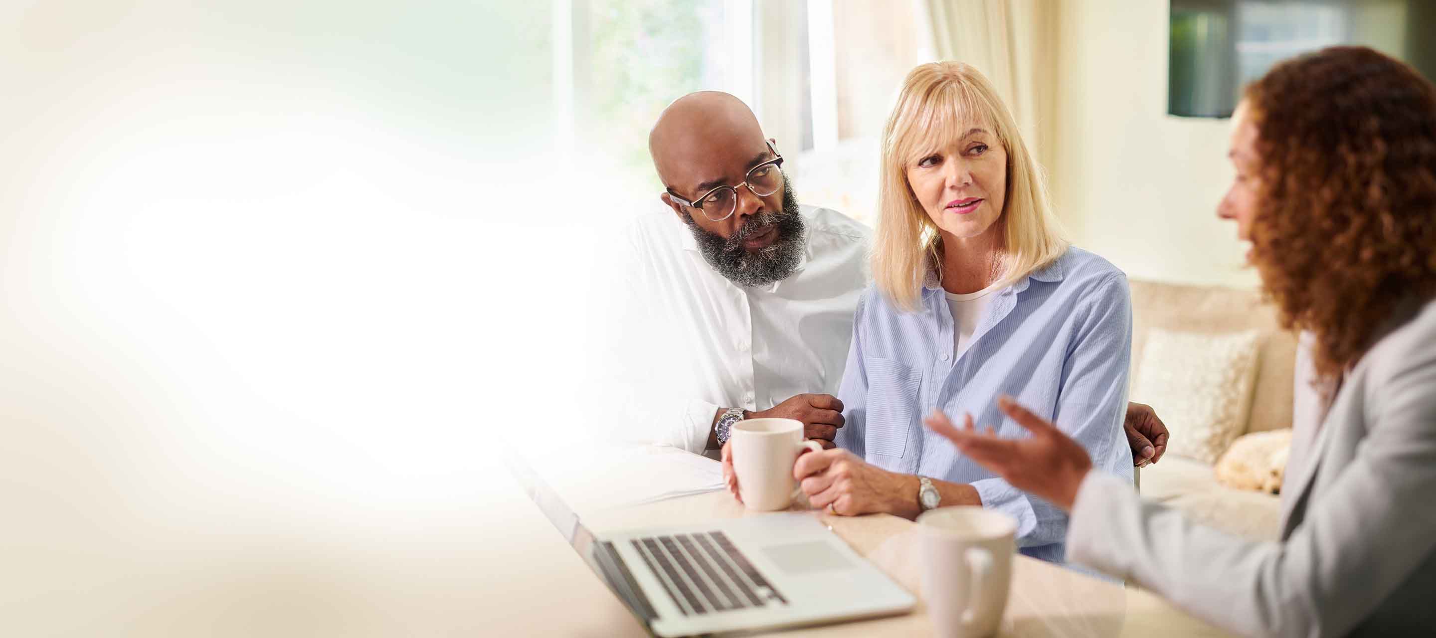 An agent provides financial assistance to a senior couple.