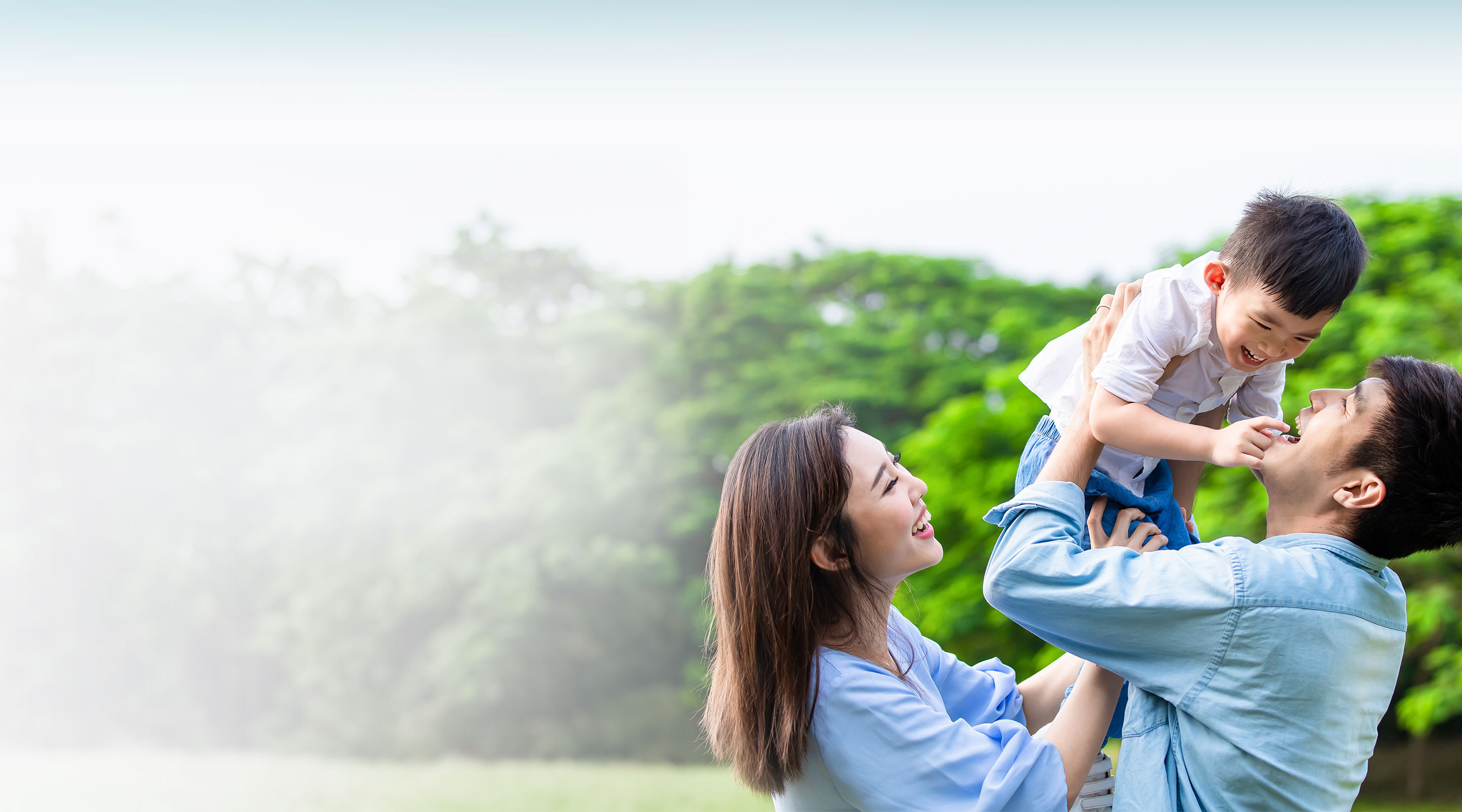 A happy Asian family spends time in the park