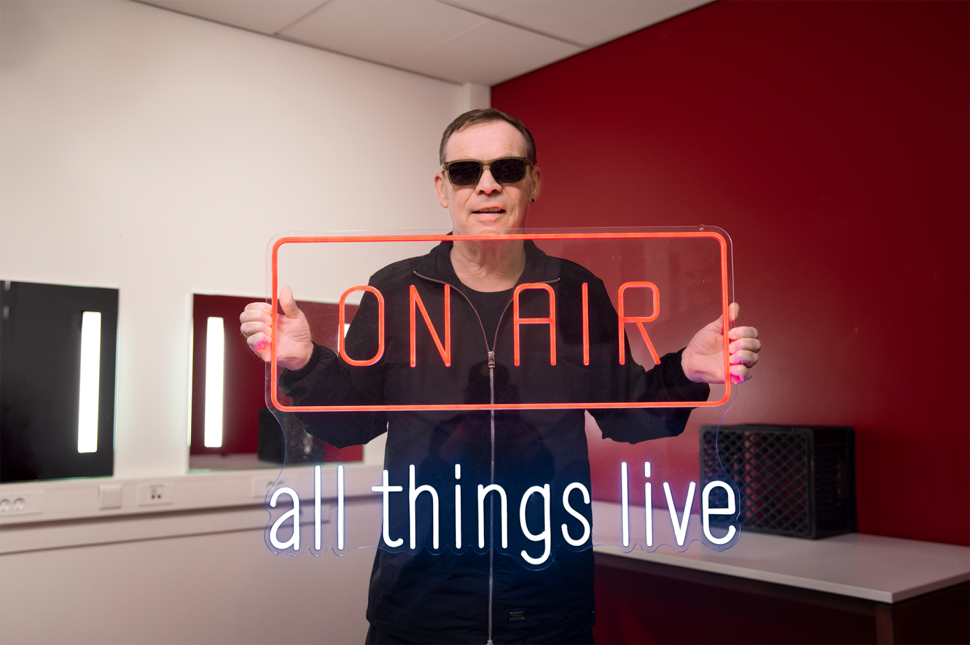 Ali Campbell UB40 holding On Air neon sign