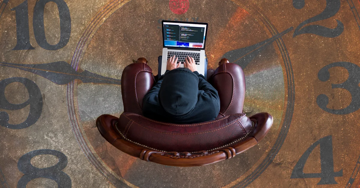 man in chair on comp