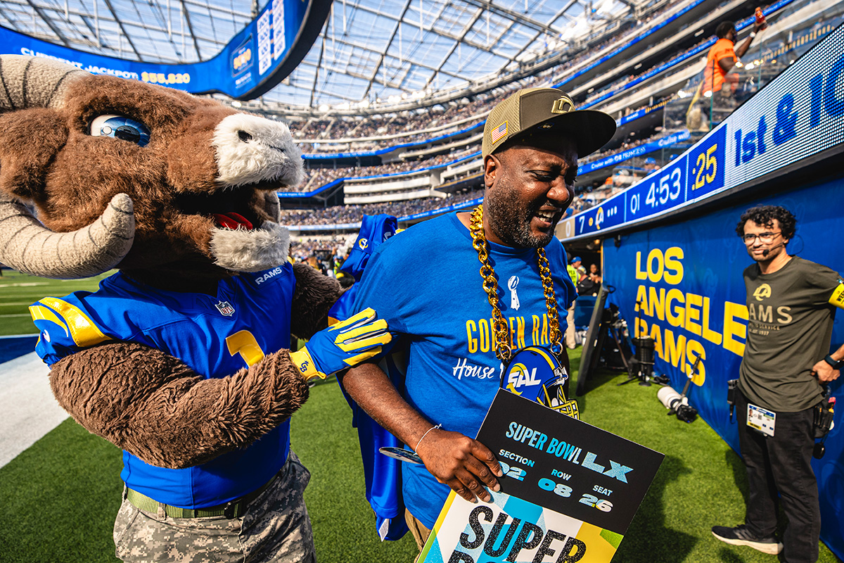 Rams mascot with fan