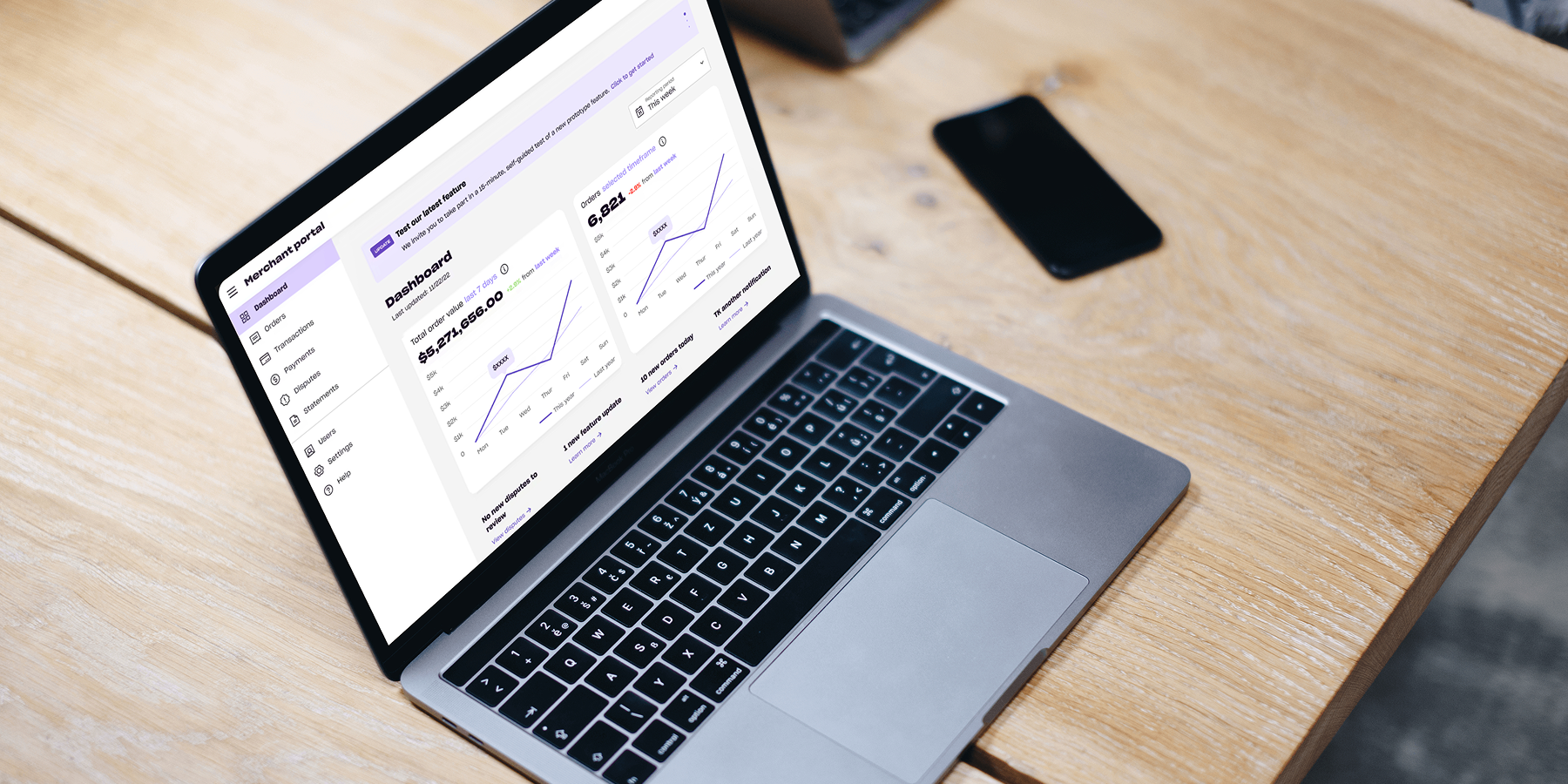 Laptop displaying retail spending and performance data on a desk