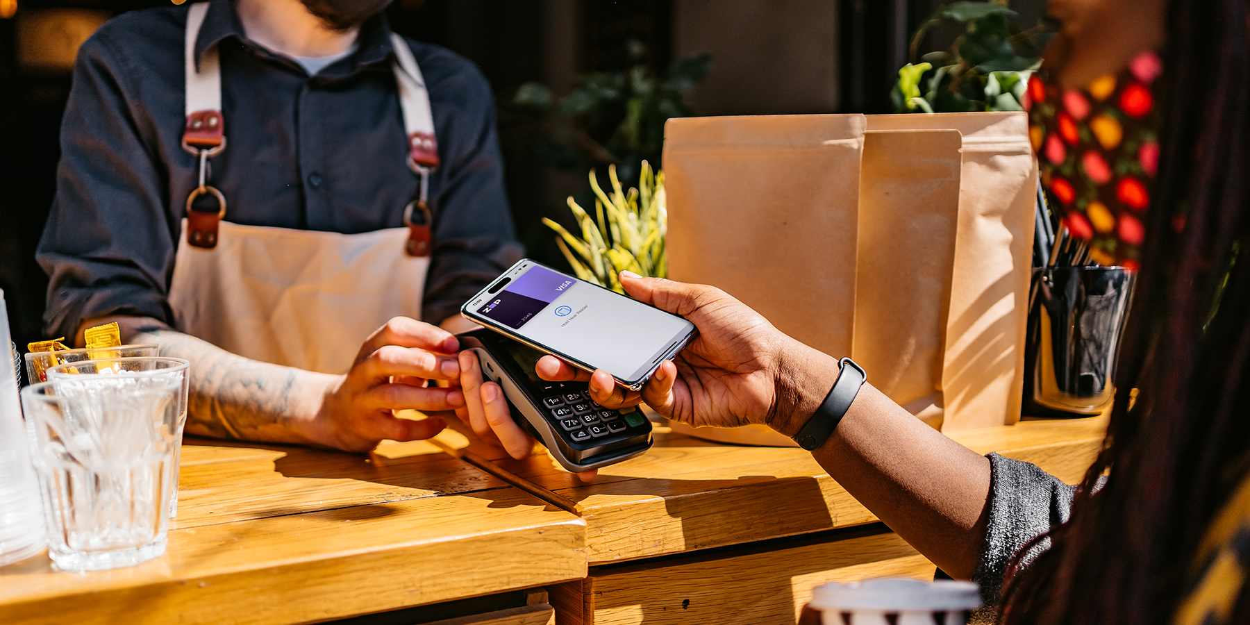 Customer making a contactless payment at an in-store checkout