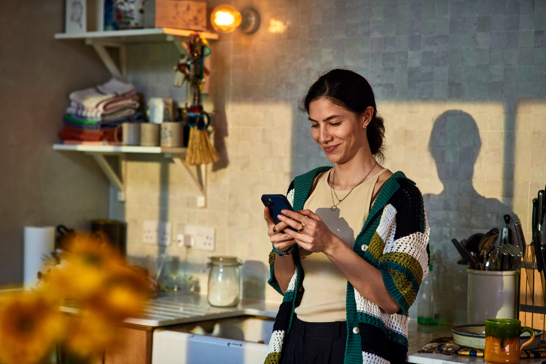 A woman using the Zip app to make a digital BNPL purchase.