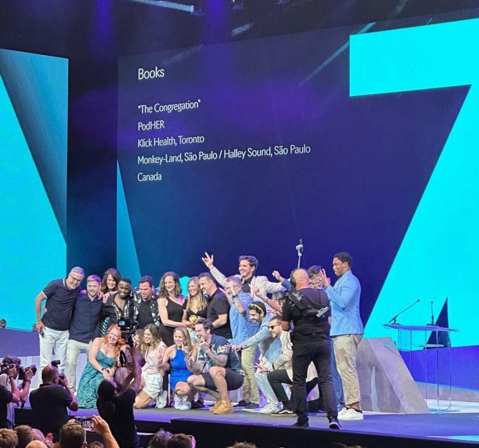 Klick team accepting Gold Lion for Design for "The Congregation" at 2023 Cannes Lions