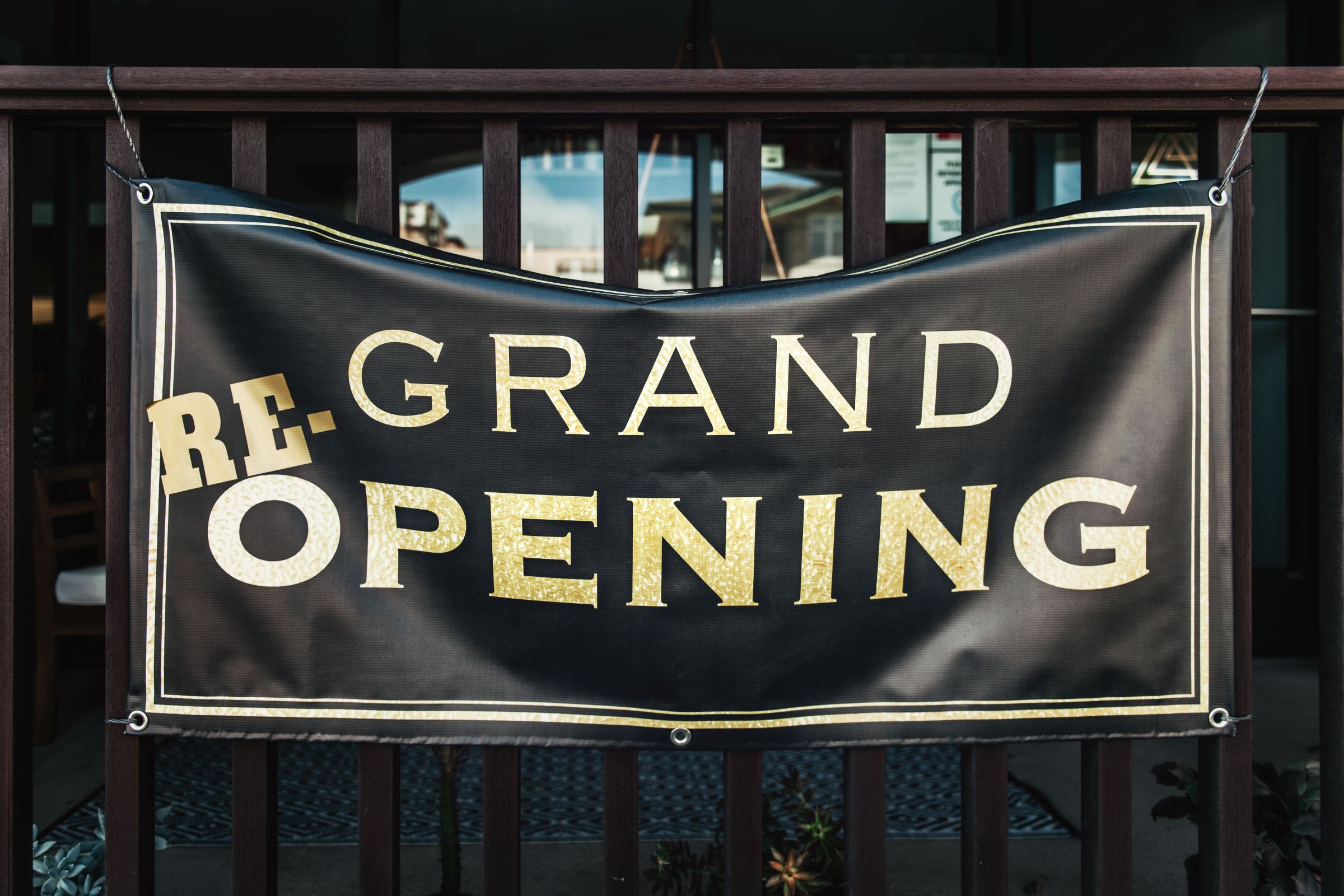 A "Grand re-opening" sign.