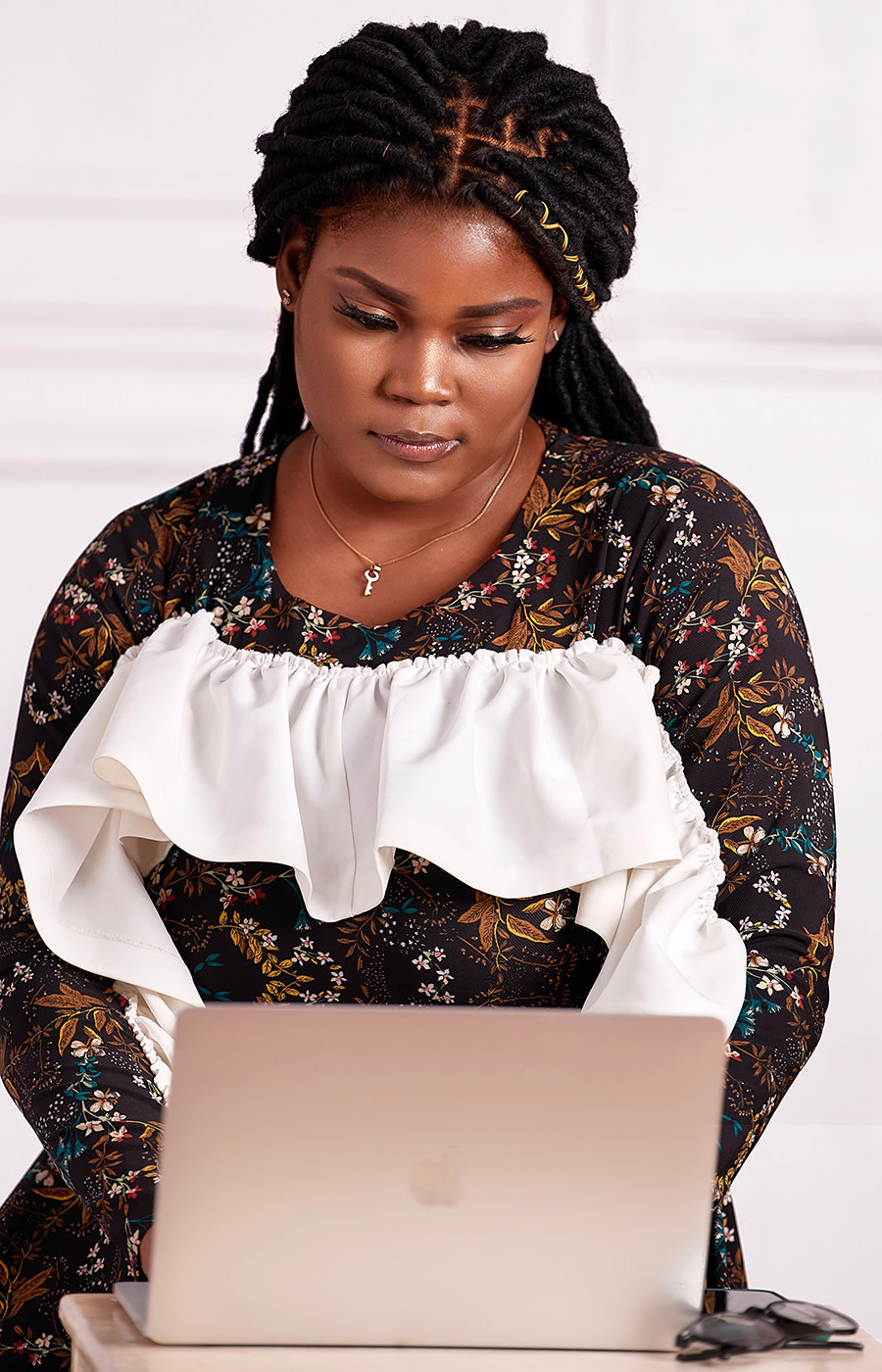 Photo of Gift Egwuenu working on her laptop.