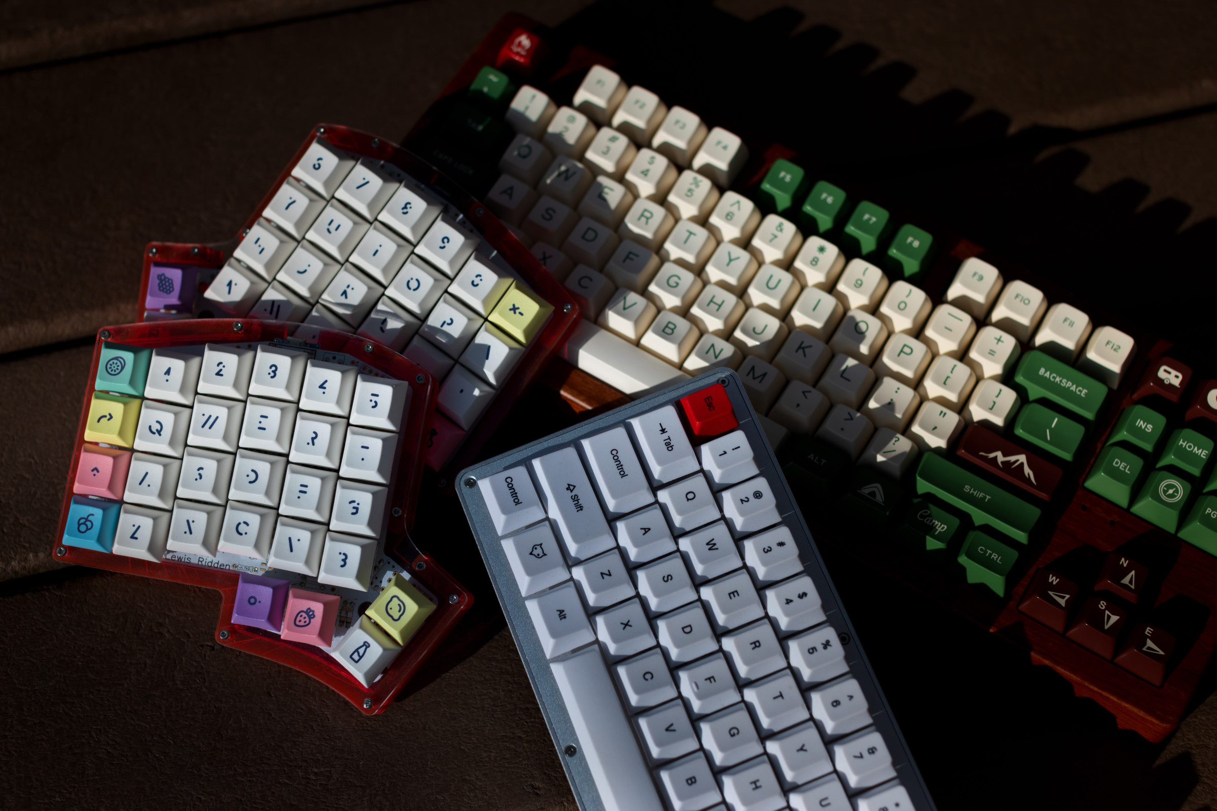 A colorful pile of mechanical keyboards built by author Cassidy