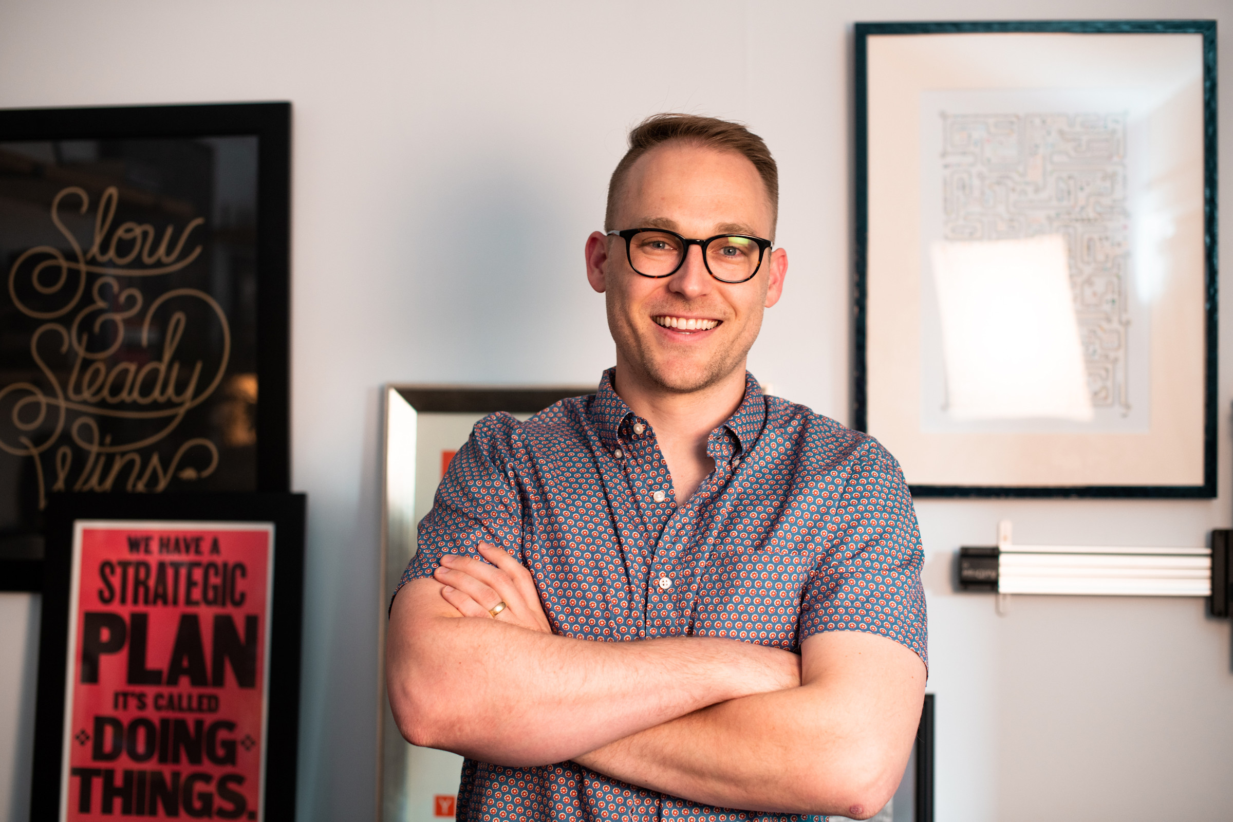 Author Aaron smiling in his office