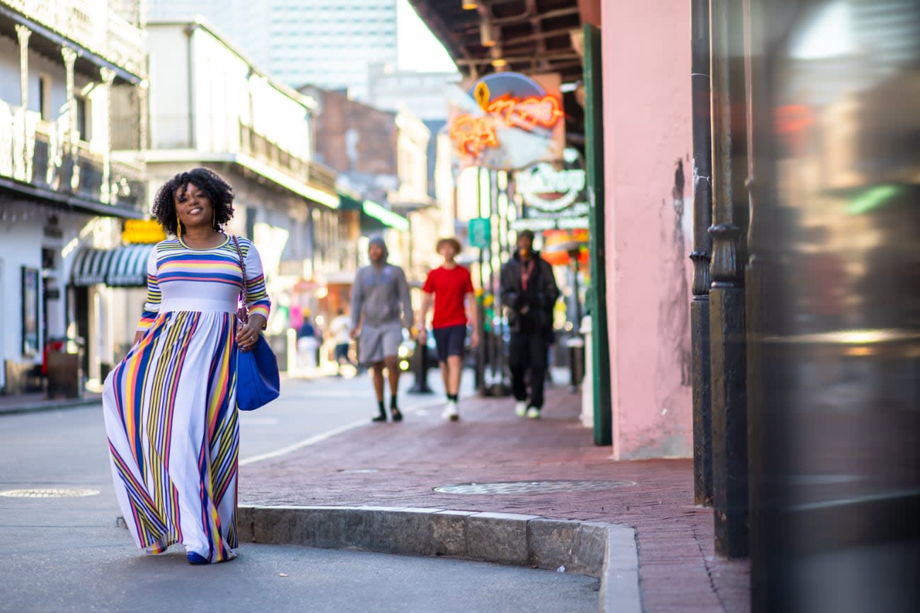 Photo of Angie Jones walking down the street.