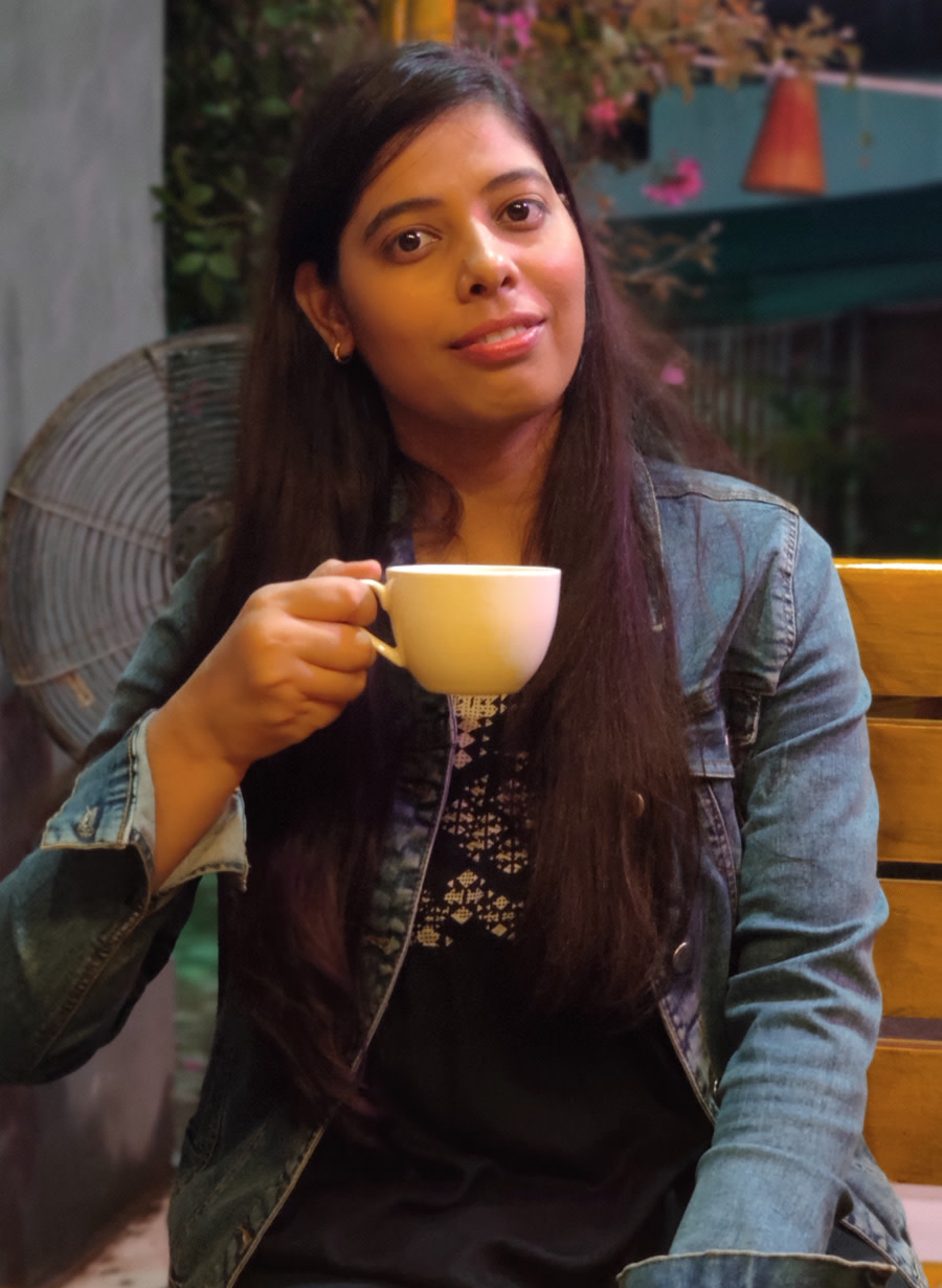 Photo of Shikha Mishra at an outdoor cafe.