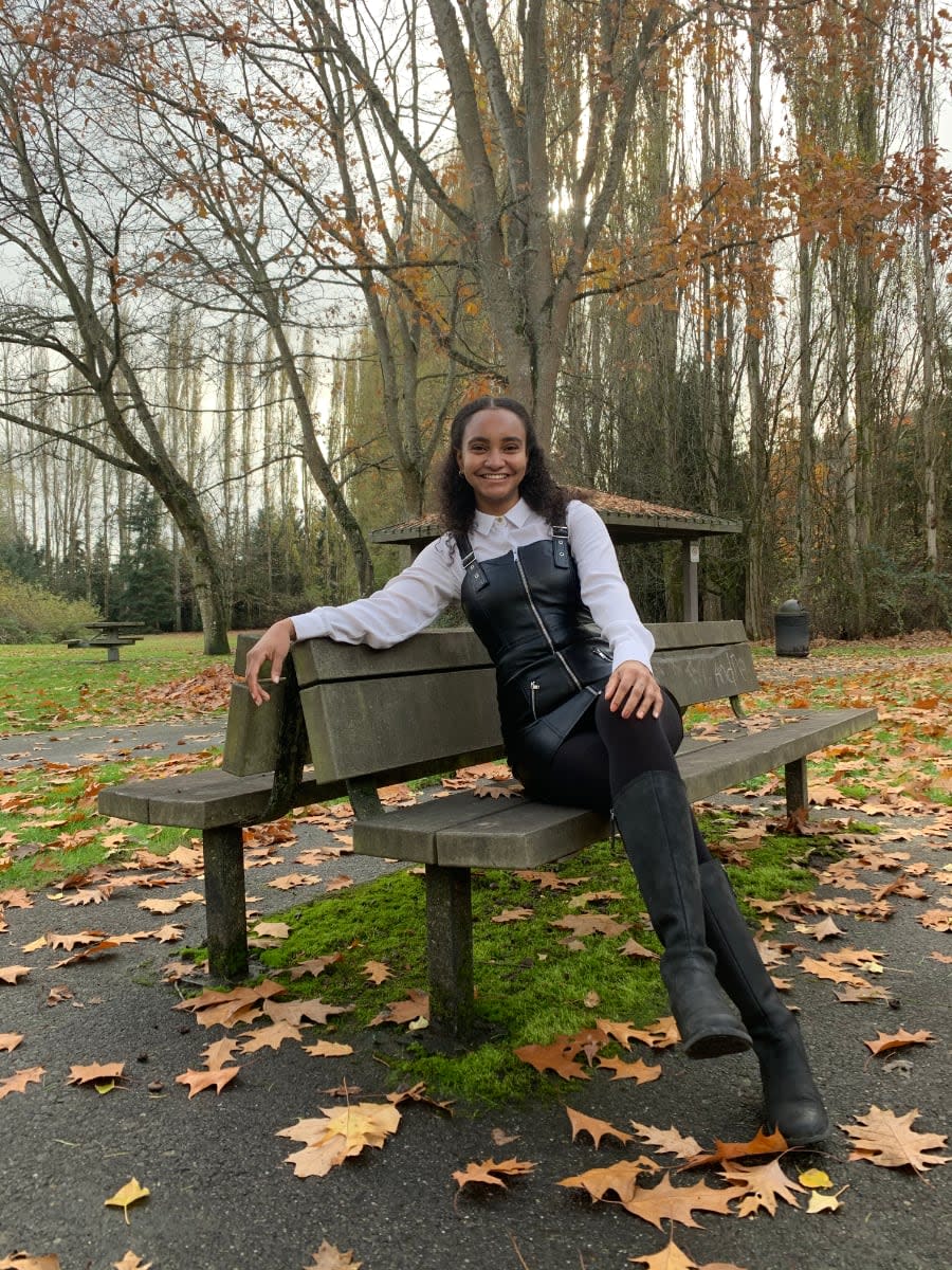 Photo of Safia Abdalla sitting outdoors.