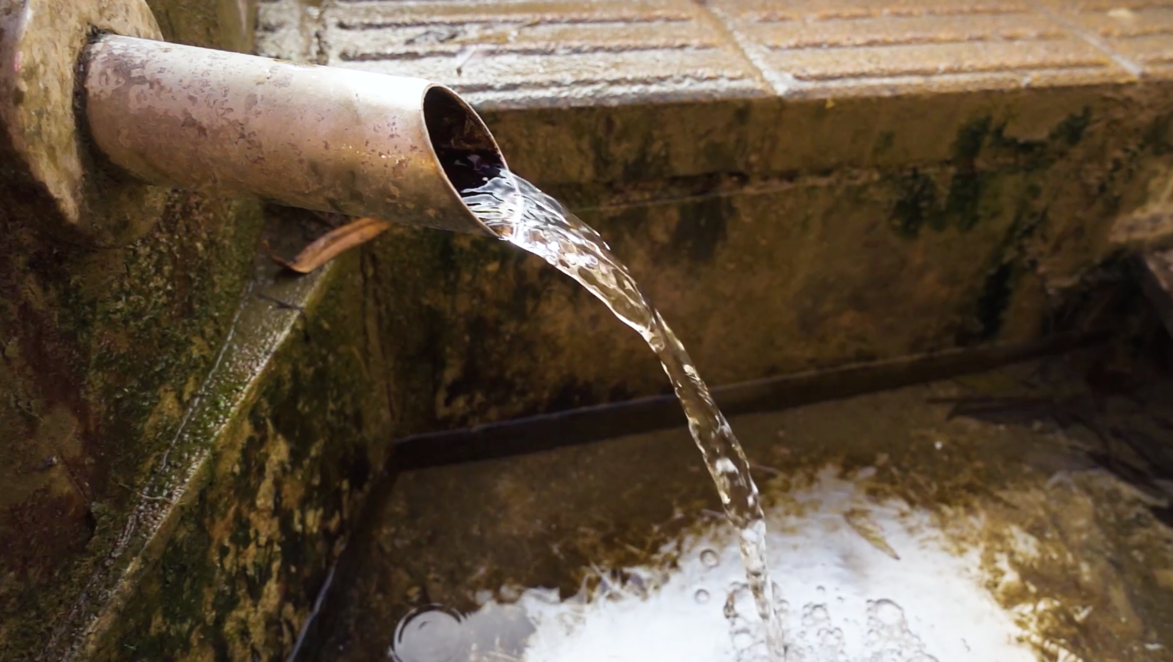 Water flowing out of a drainage pipe