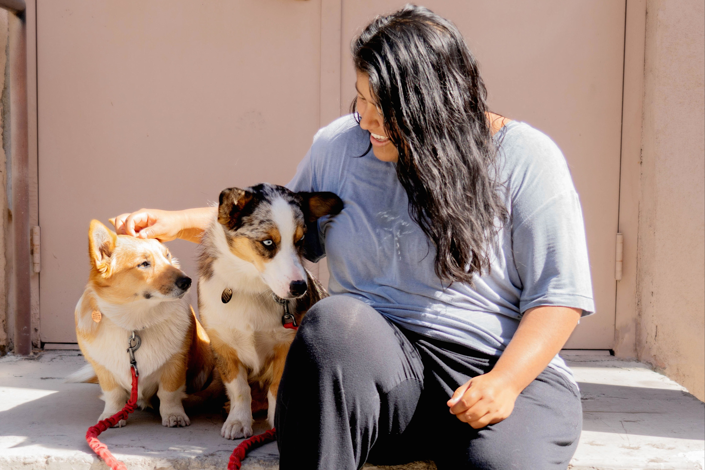 Author Frances sitting outside with her two dogs