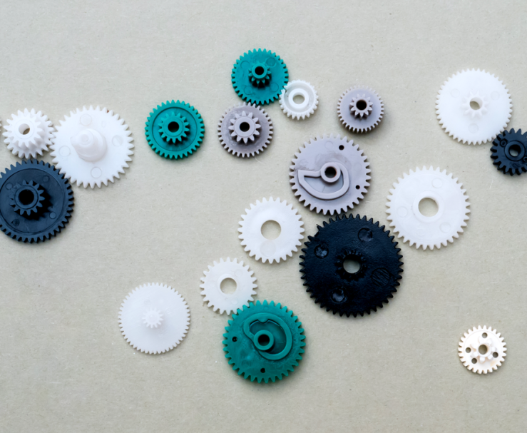 A collection of colored cogs connected in various ways.