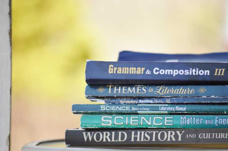 Educational books stacked on top of each other