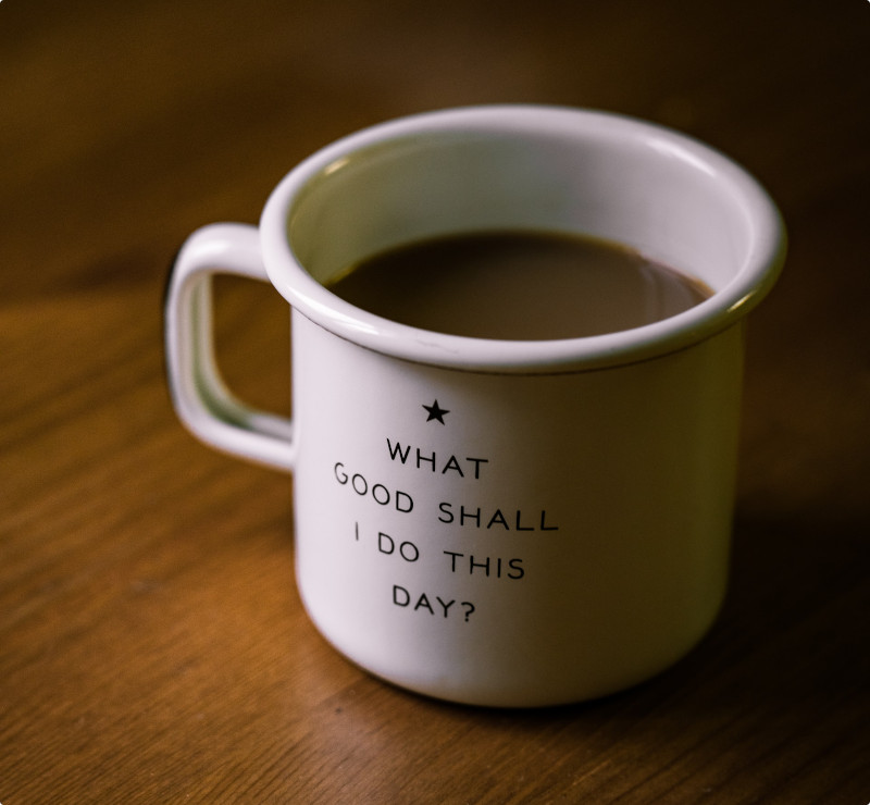 Coffee-filled white melamine mug with text