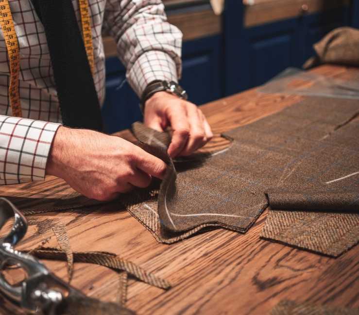 A tailor custom making an outfit