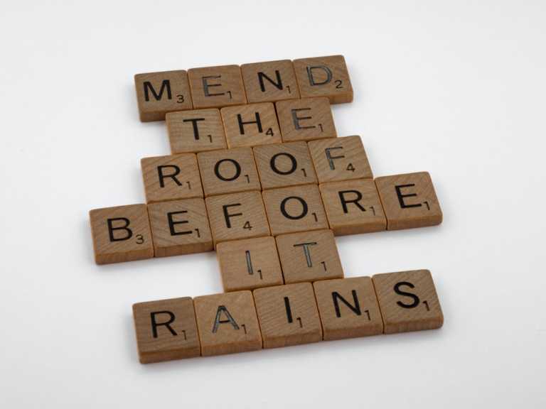 Scrabble letter tiles put together saying "Mend the roof before it rains" 