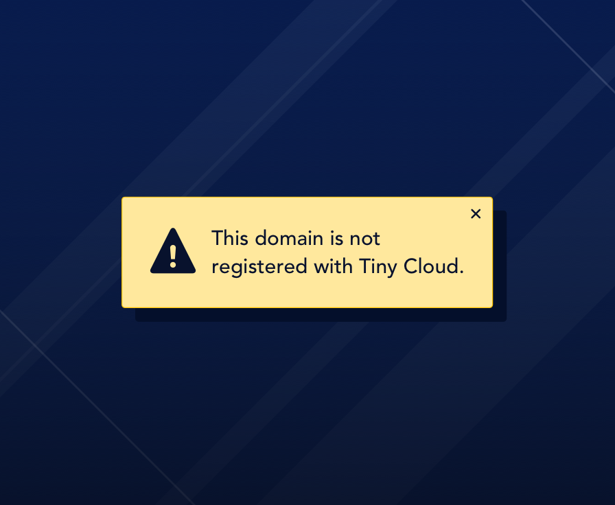 Notification message reading "This domain is not registered with Tiny Cloud."