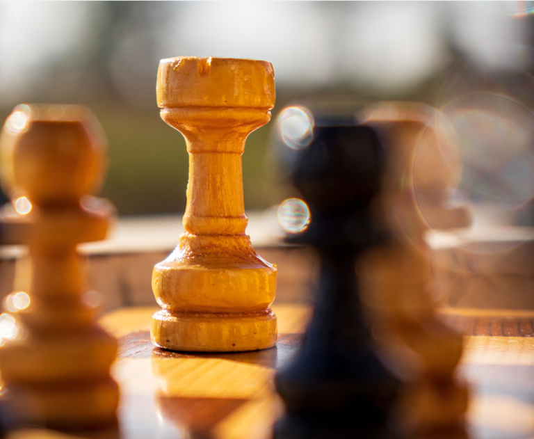 Photograph of chess pieces on a chess board. Image by Wooden Earth Ltd (https://www.woodenearth.com/) by Image by Wooden Earth Ltd