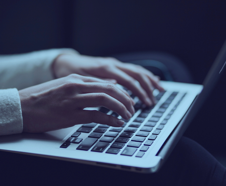 Person typing on laptop 