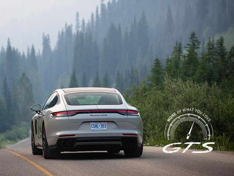 Porsche Taycan GTS saloon driving on tree-lined Canadian road
