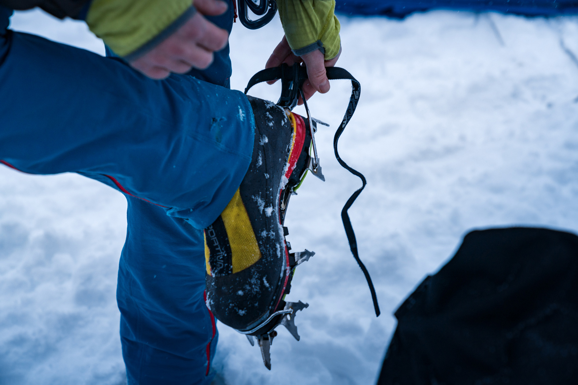 Climbing boots with spikes on to conquer ice