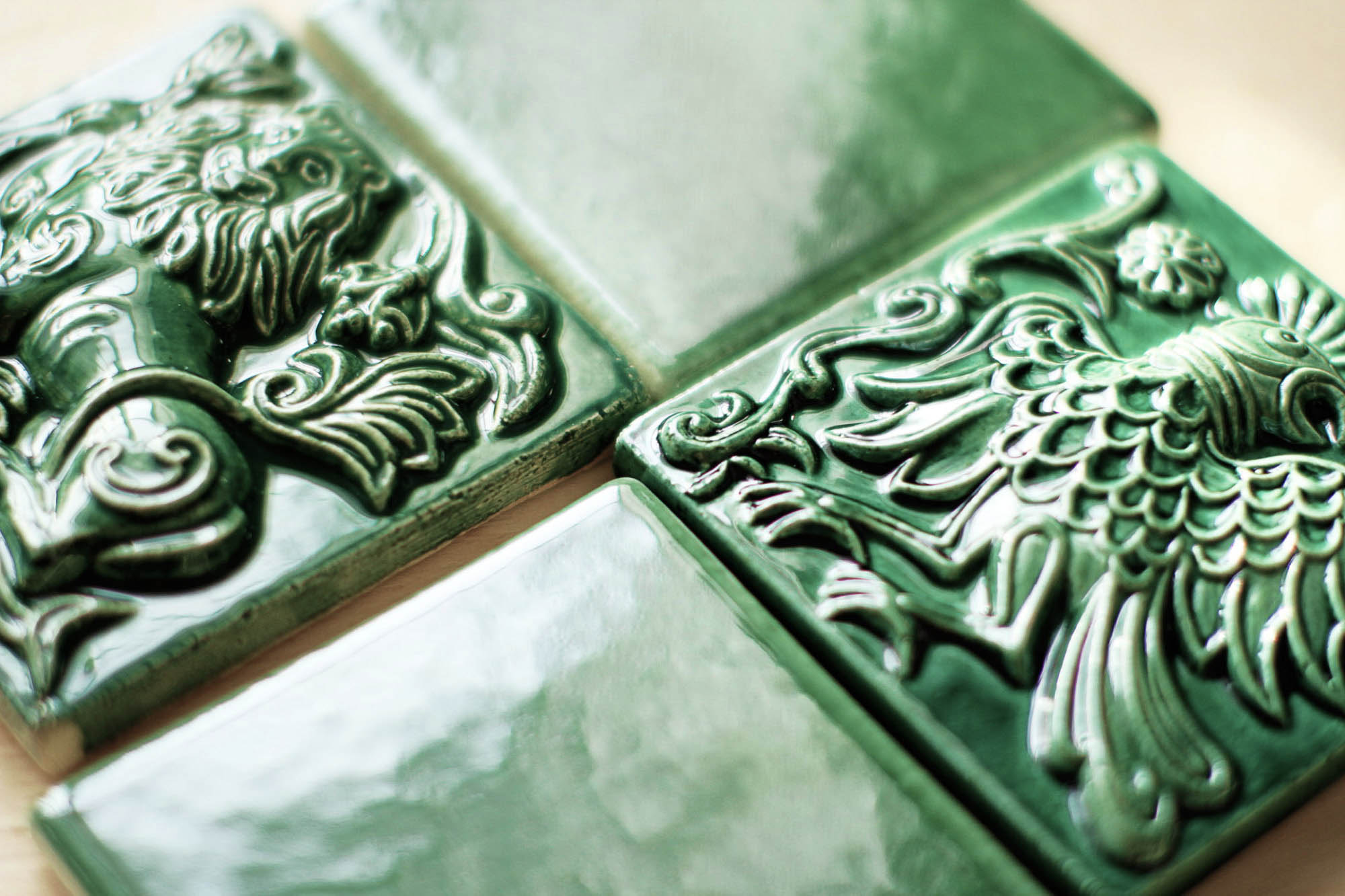 Classic decorated ceramic craftmanship on green tiles