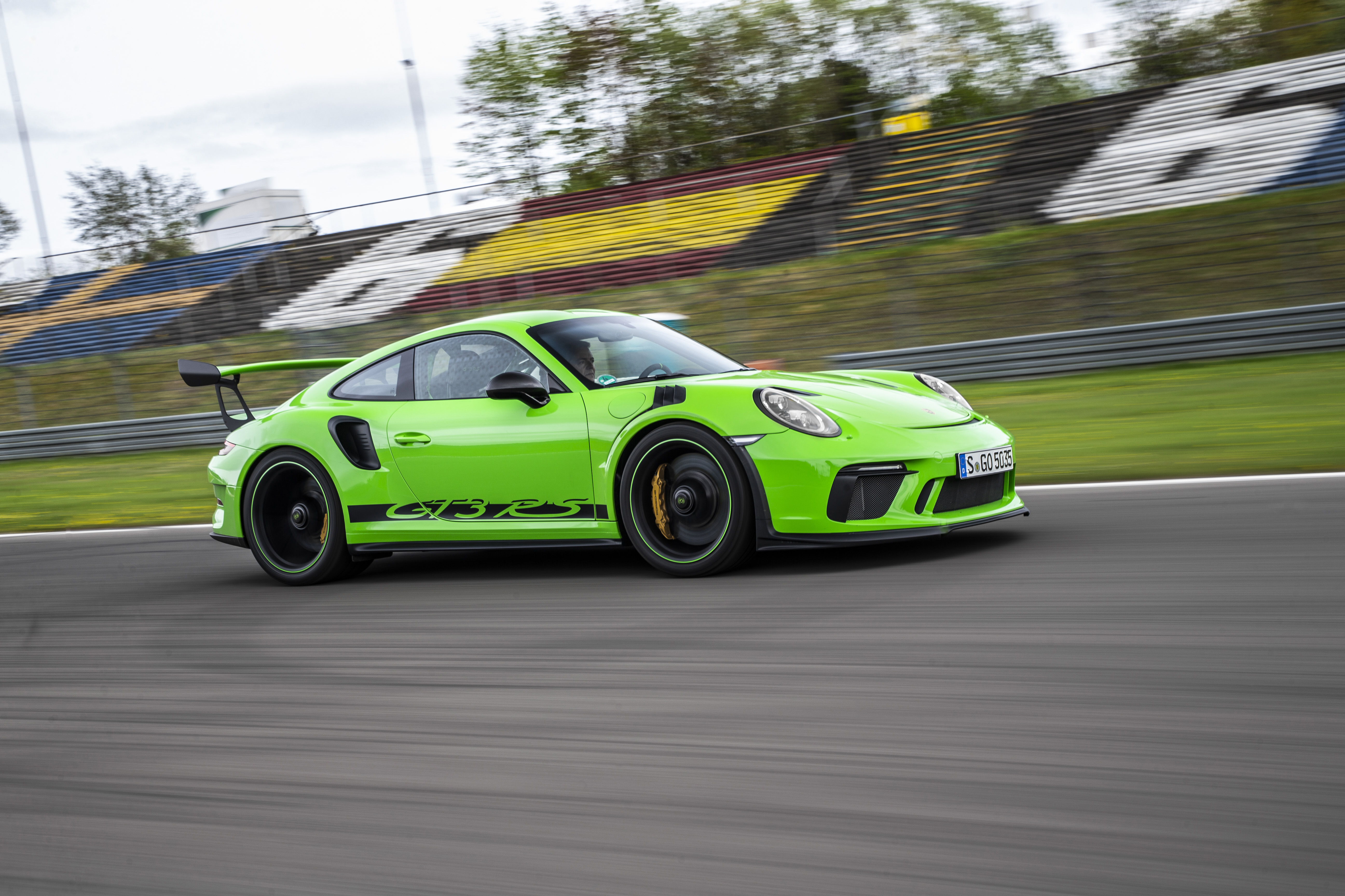 Bright green Porsche 911 GT3 RS (type 991.2) on track