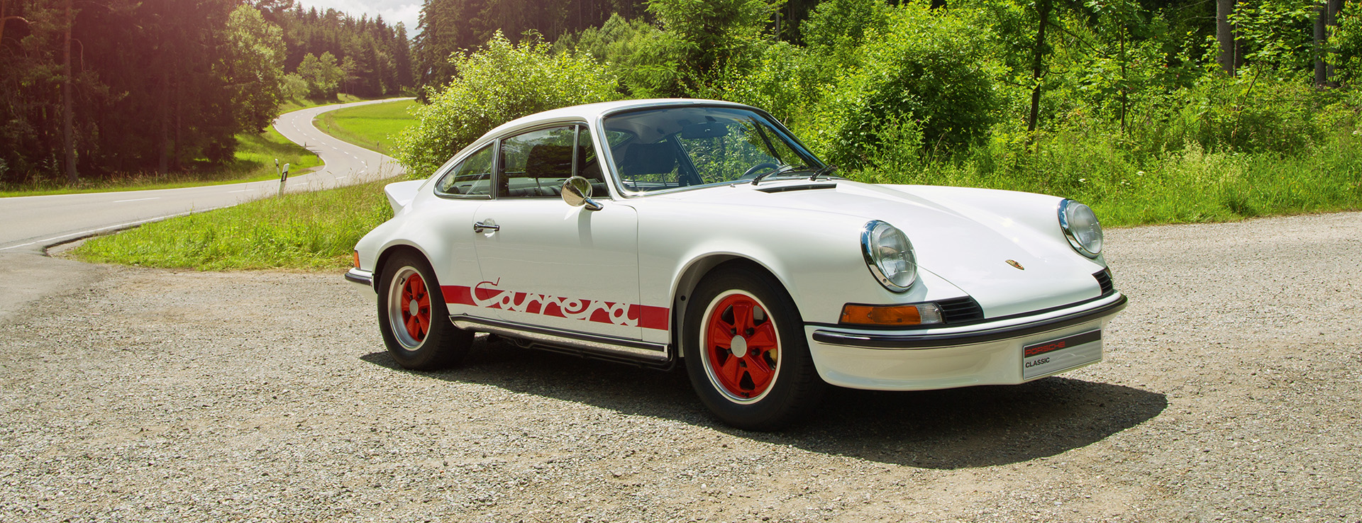 White with red Porsche 911 Carrera RS 2.7 with ducktail