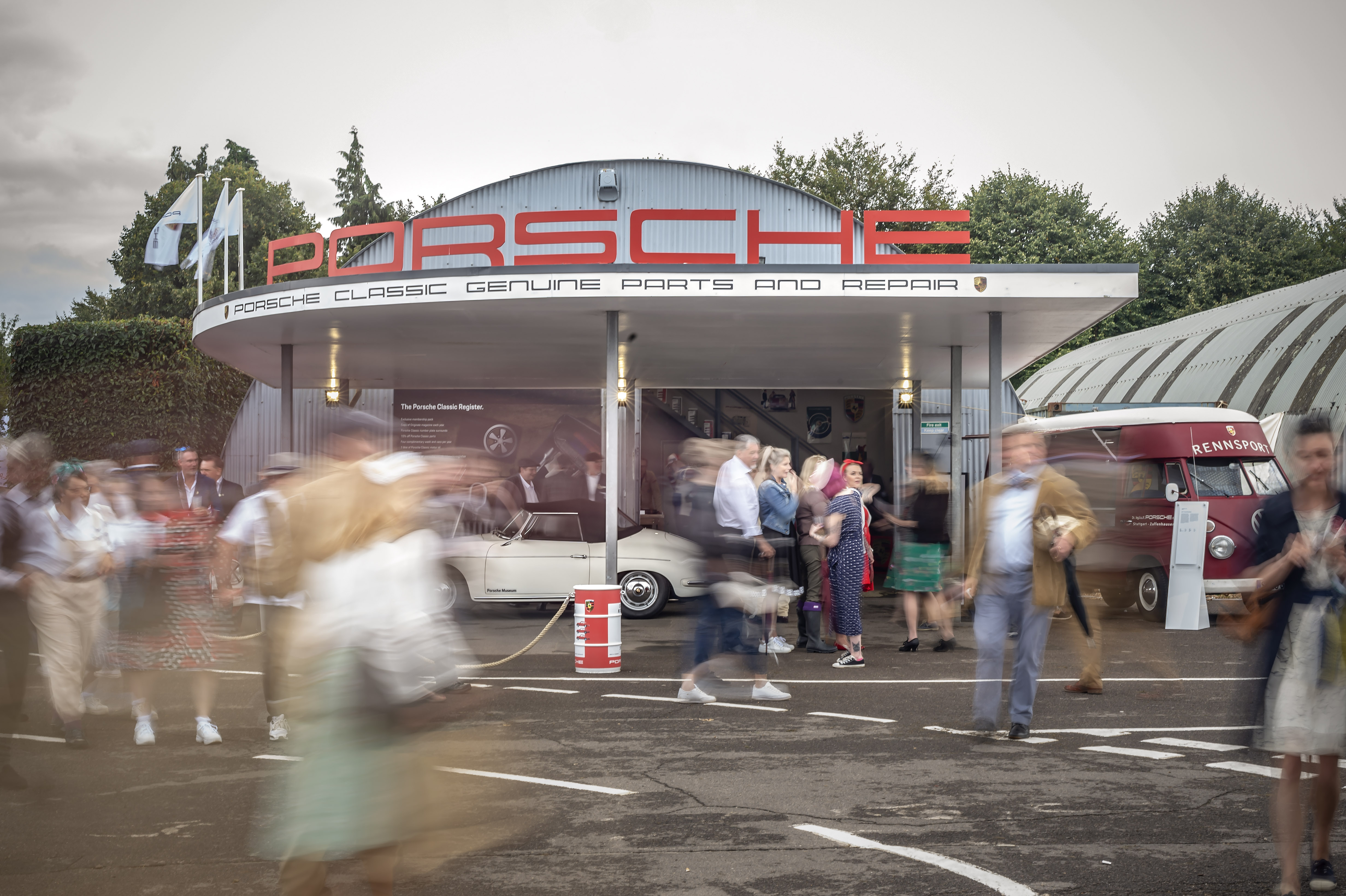 People outside Porsche stand at Goodwood Revival event