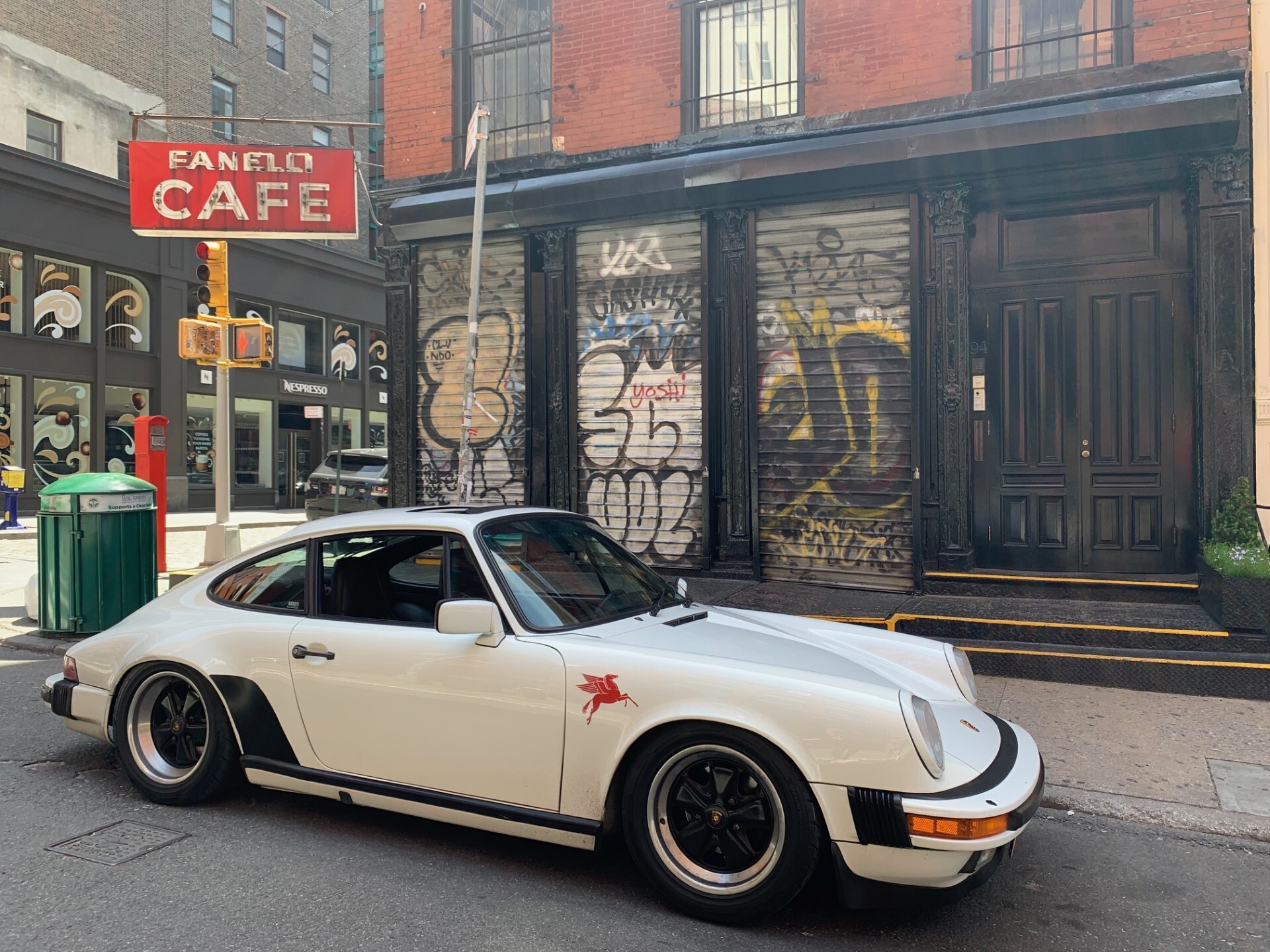 White Porsche 911 (type G-series) parked on New York street