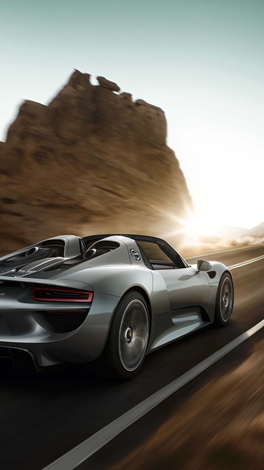 porsche 918 spyder driving desert road wallpaper mobile