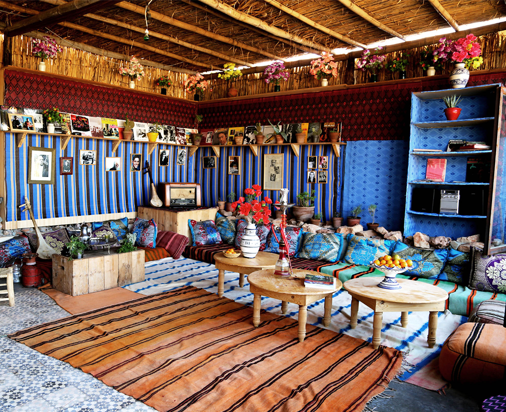 Colourful Moroccan interior with floor cushions and patterned rugs