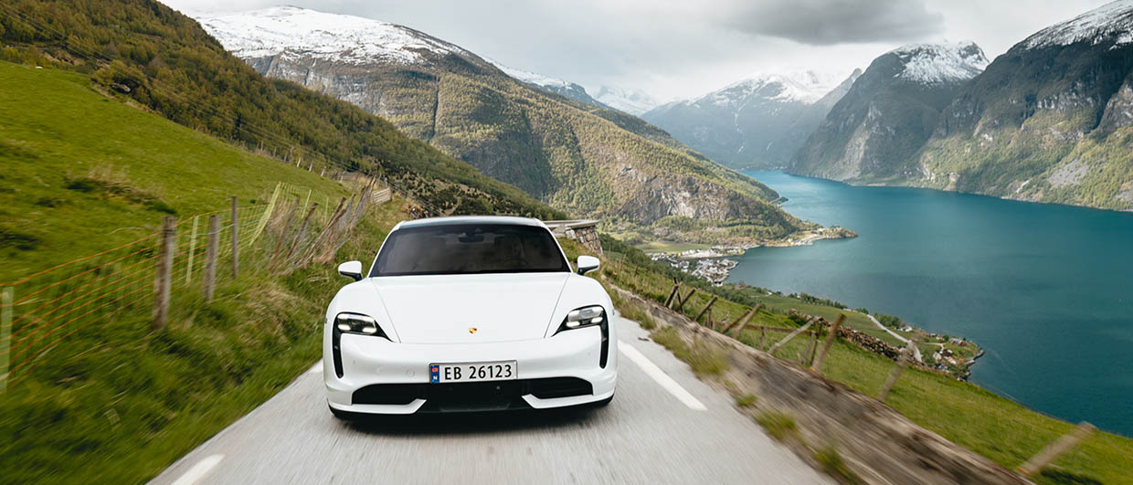 White Porsche Taycan in Norwegian landscape