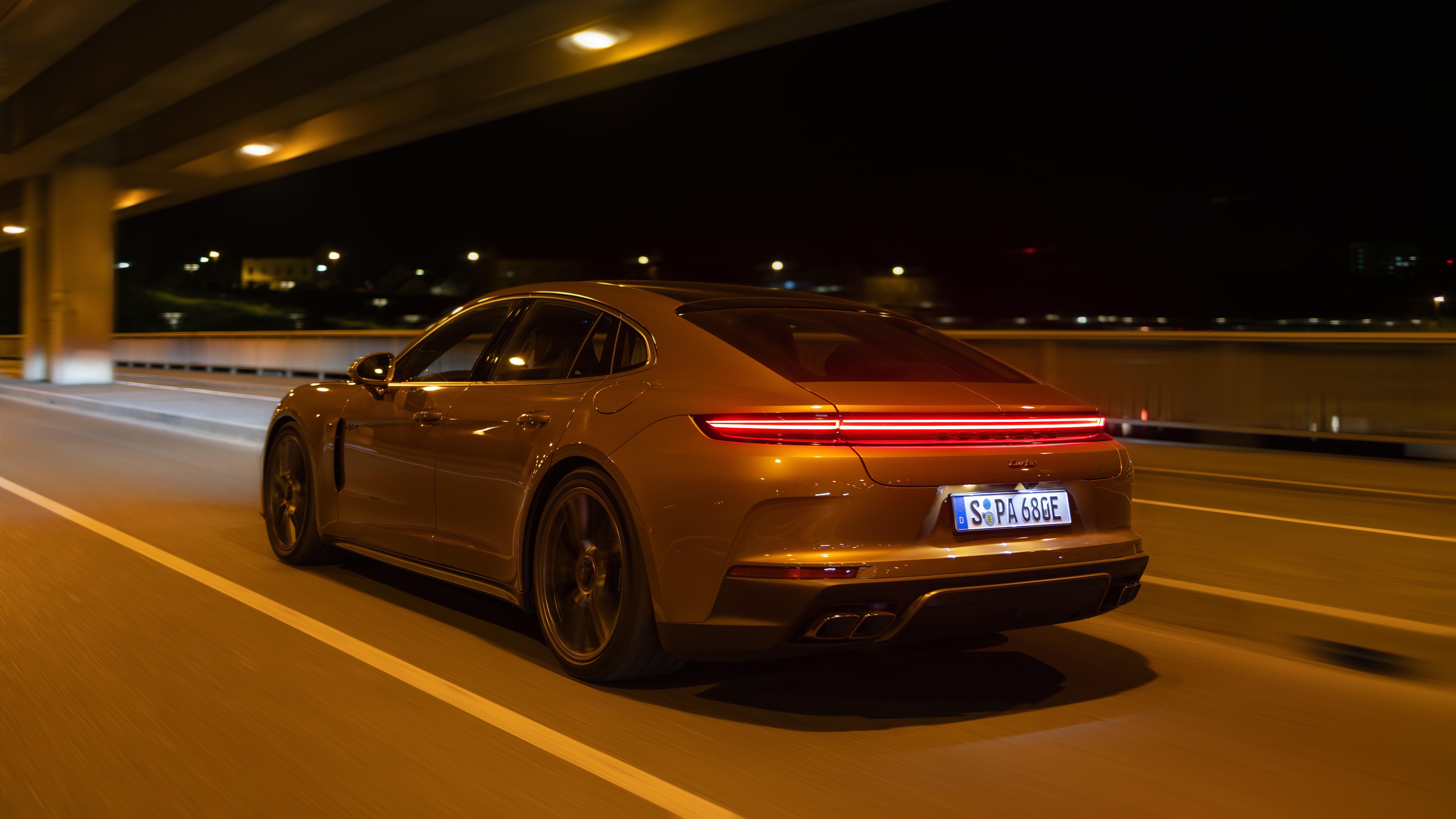Porsche Panamera Turbo E-Hybrid at night, showing rear lighting