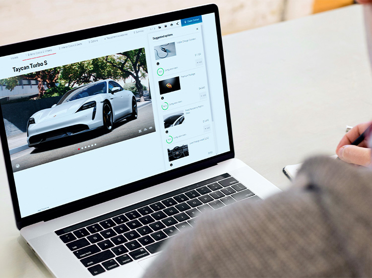 Person looking at Porsche configurator on Apple MacBook screen