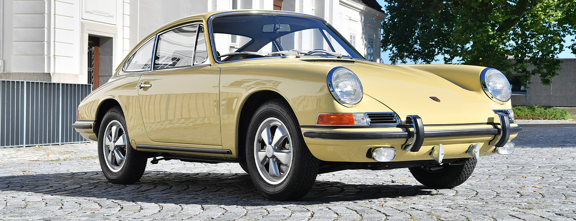 Classic Porsche 901 in yellow in country lane