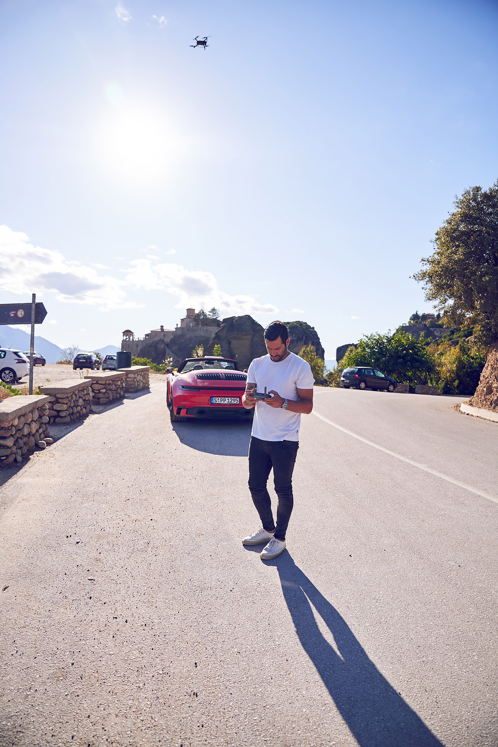 Costas Spathis with his drone and the Porsche 911 Cabriolet