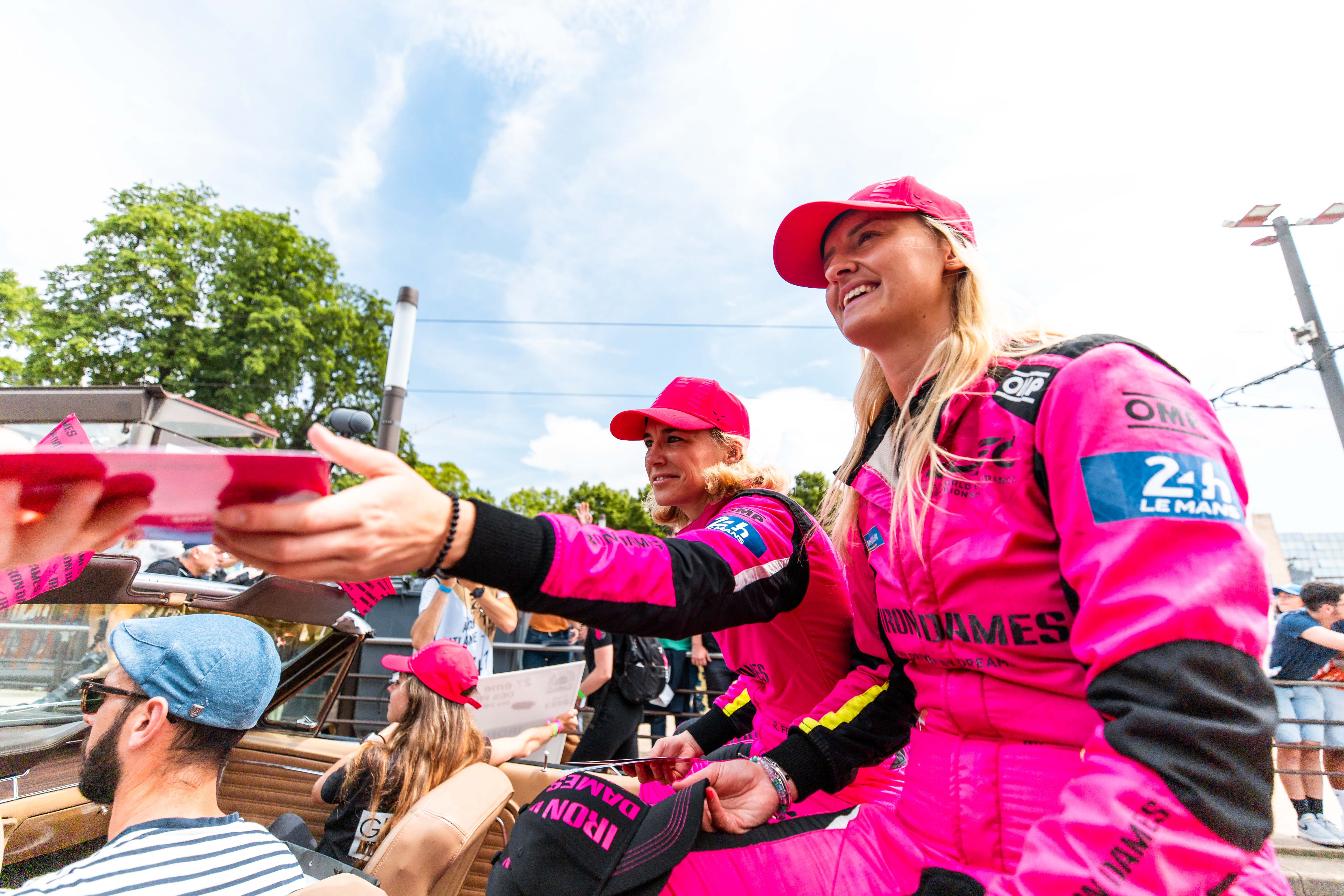 Iron Dames racing team signing autographs at Le Mans