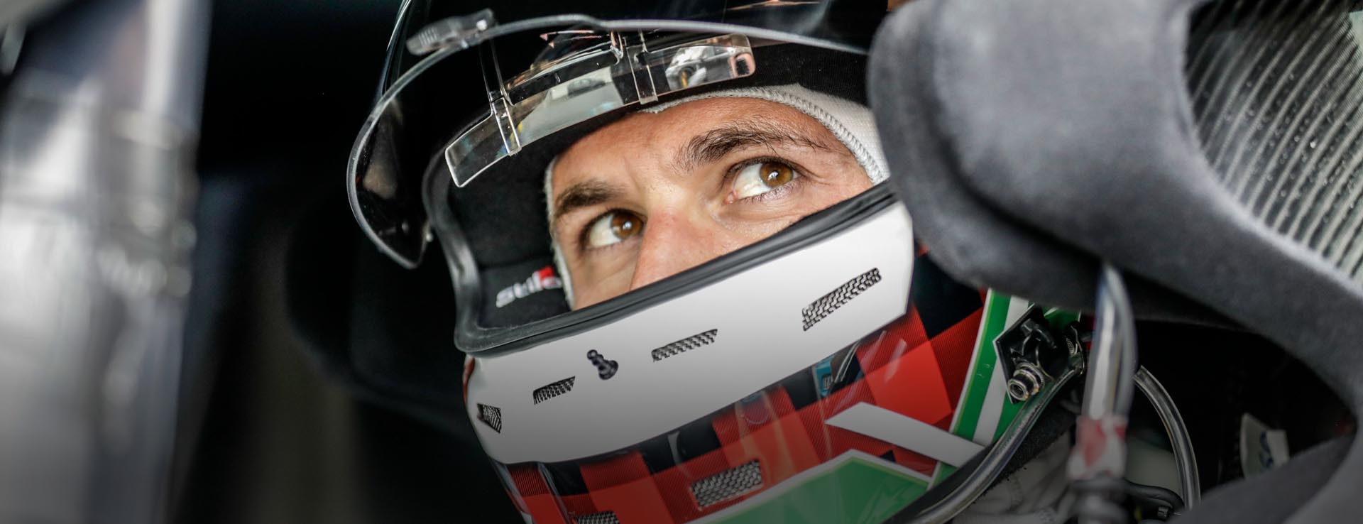 Close-up of Lars Kern Porsche test driver in helmet